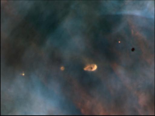 A View of Clouds of Cosmic Dust in the Region of Orion